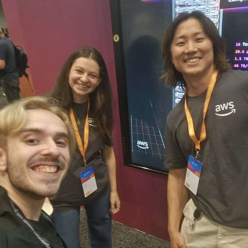 Bojan Jakimovski takes a group selfie with two AWS team members at AWS Summit New York 2025.